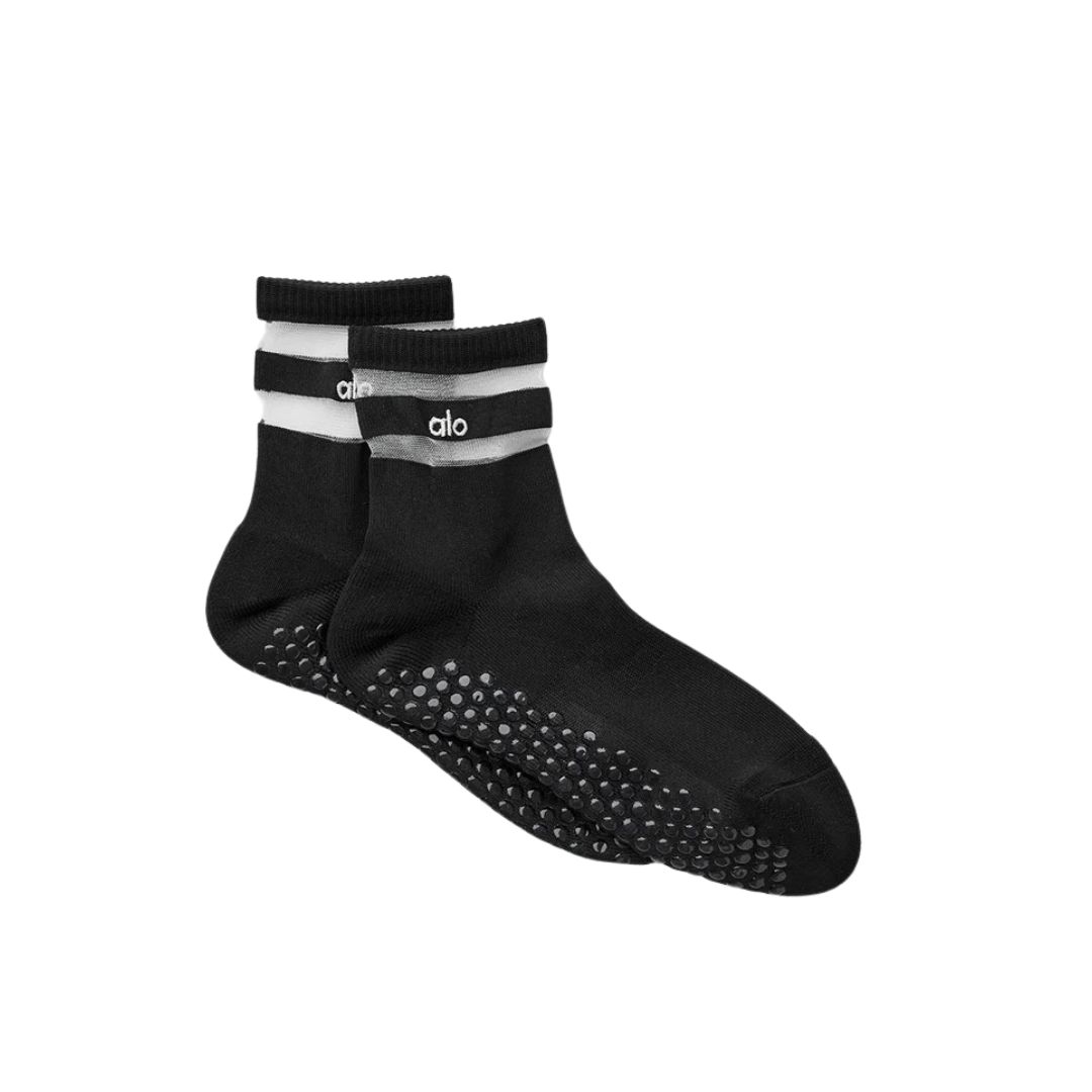 A pair of grip socks designed for Pilates to provide traction and stability.