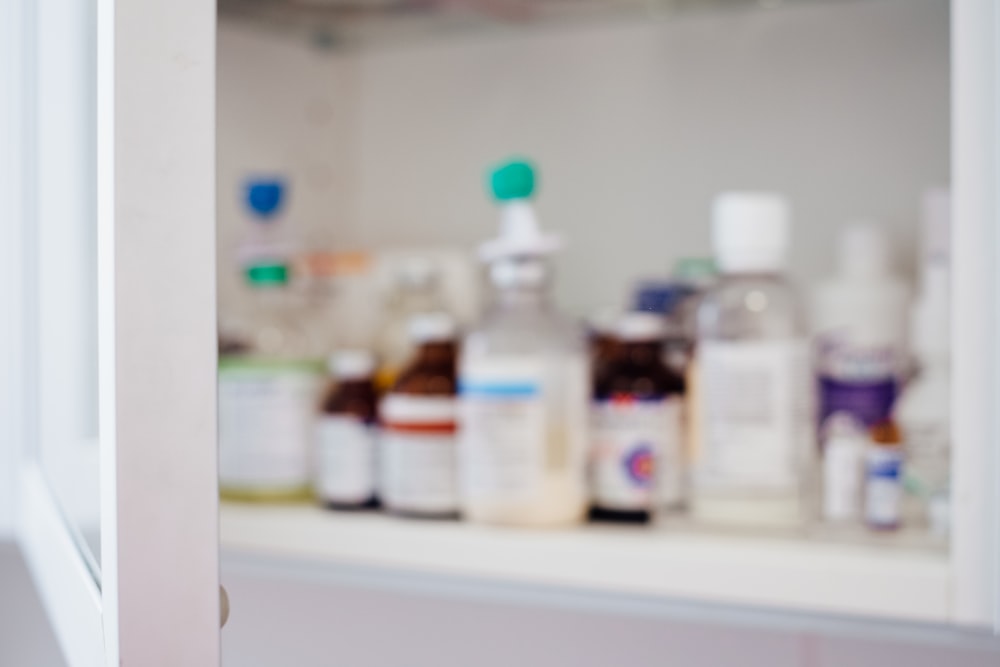 A licensed pharmacist working behind a modern medication counter