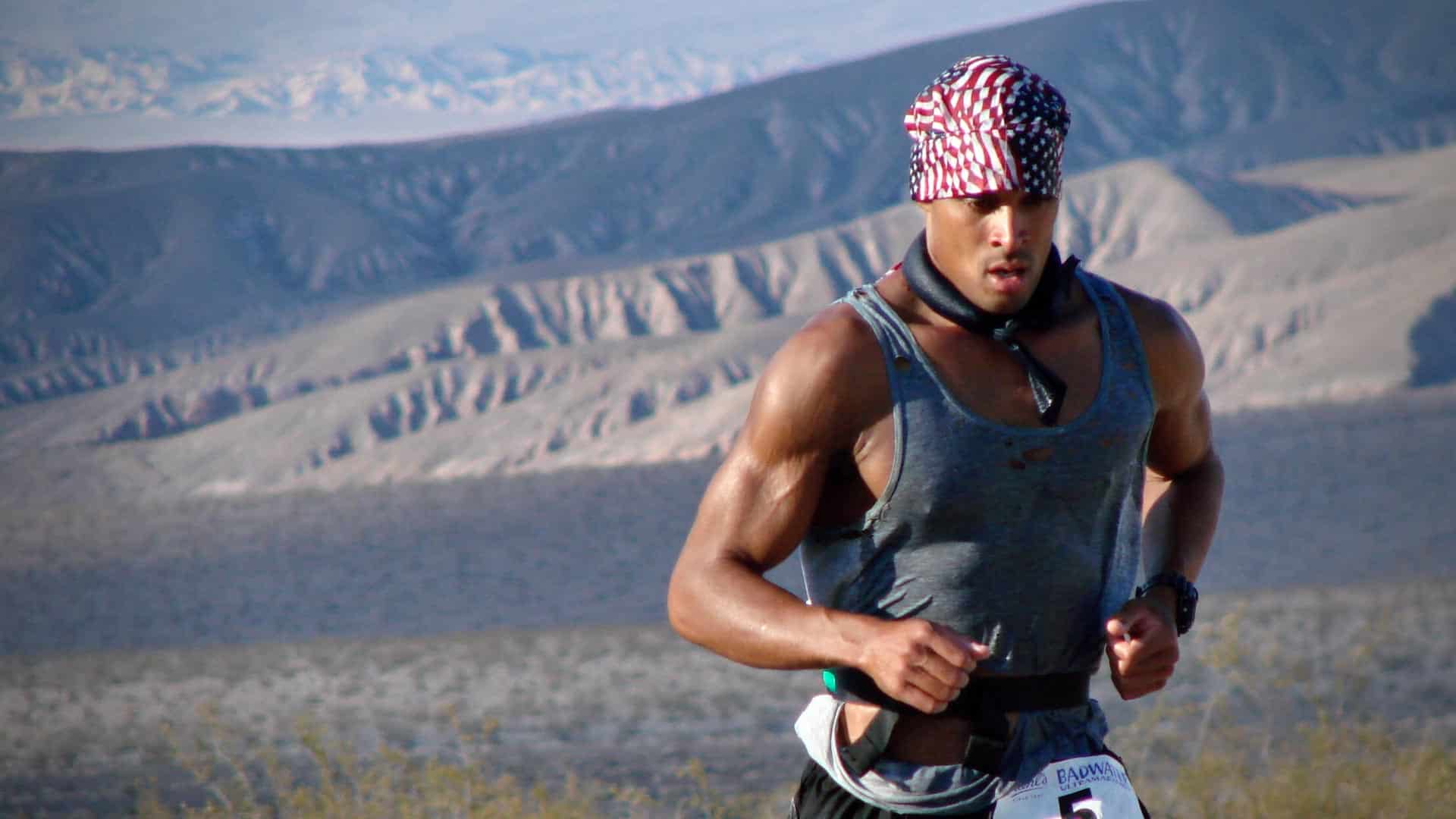 A portrait of David Goggins in athletic gear, representing ultramarathon mental toughness.
