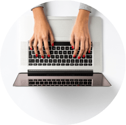 A woman using a laptop to order a health test kit online from her living room.