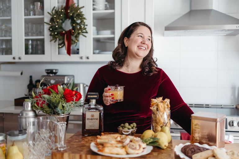 Festive holiday drink setup with glassware and seasonal garnishes.