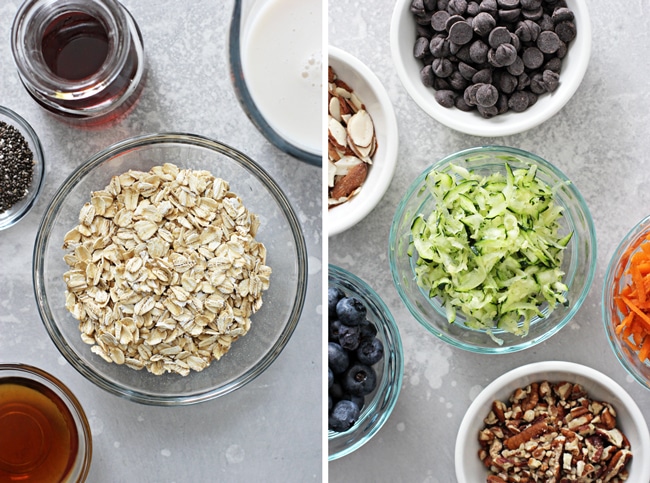 Bowls containing dry rolled oats, black chia seeds, and fresh berries laid out on a table.