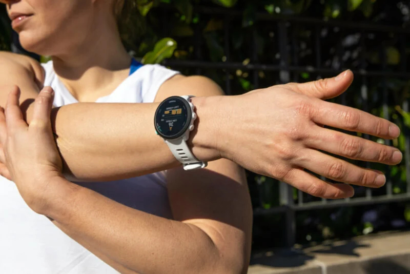 The Garmin Forerunner 945 running watch showing GPS and mapping features.