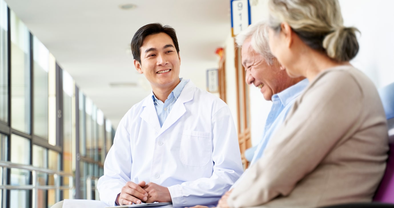 A medical professional and patient engaging in a constructive dialogue within a bright clinic setting.