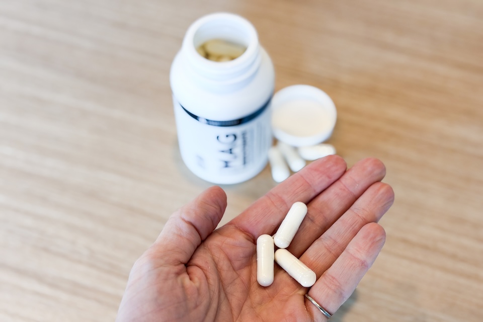 A bottle of Transparent Labs MAG bisglycinate magnesium supplement.