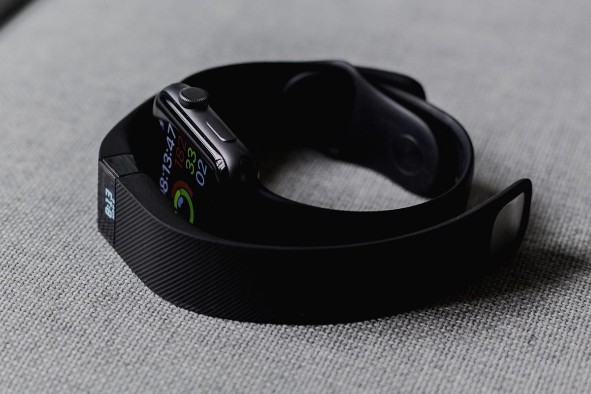 A close-up view of a person checking their daily step progress on a modern fitness tracker.