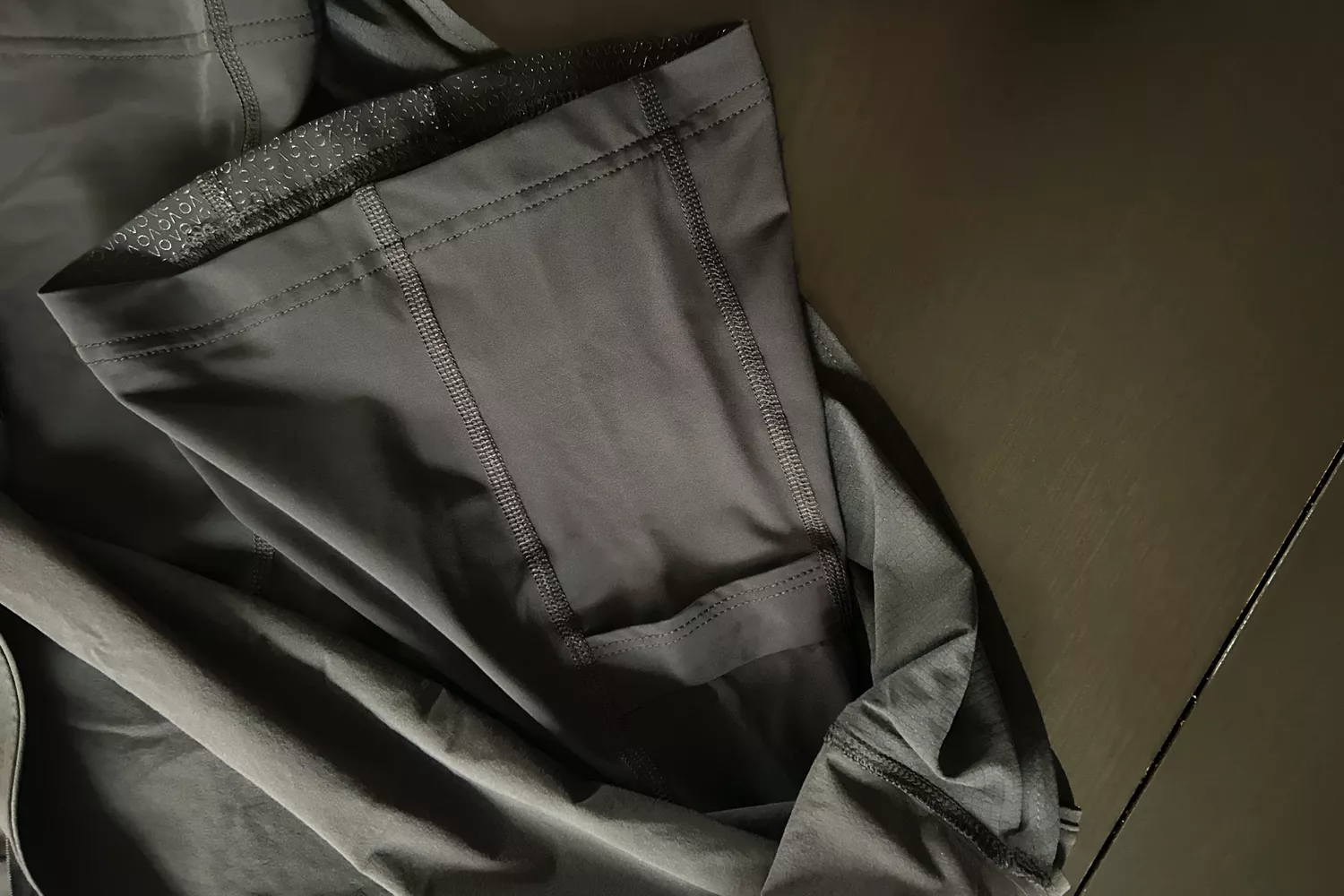 Close-up of the interior stitching and pocket design of a dark gray athletic skort.