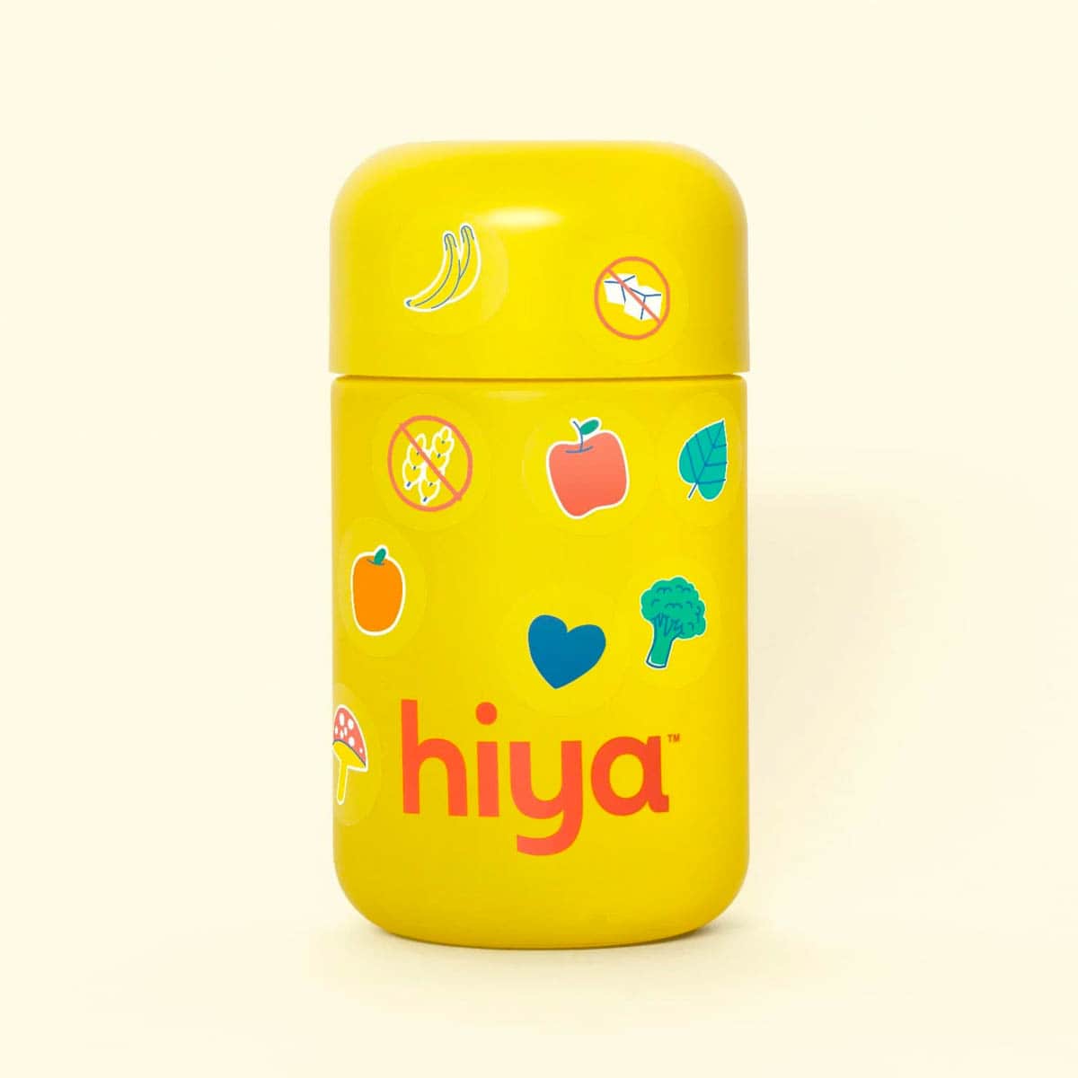 A yellow glass bottle of Hiya kids multivitamins centered on a matching bright yellow background.