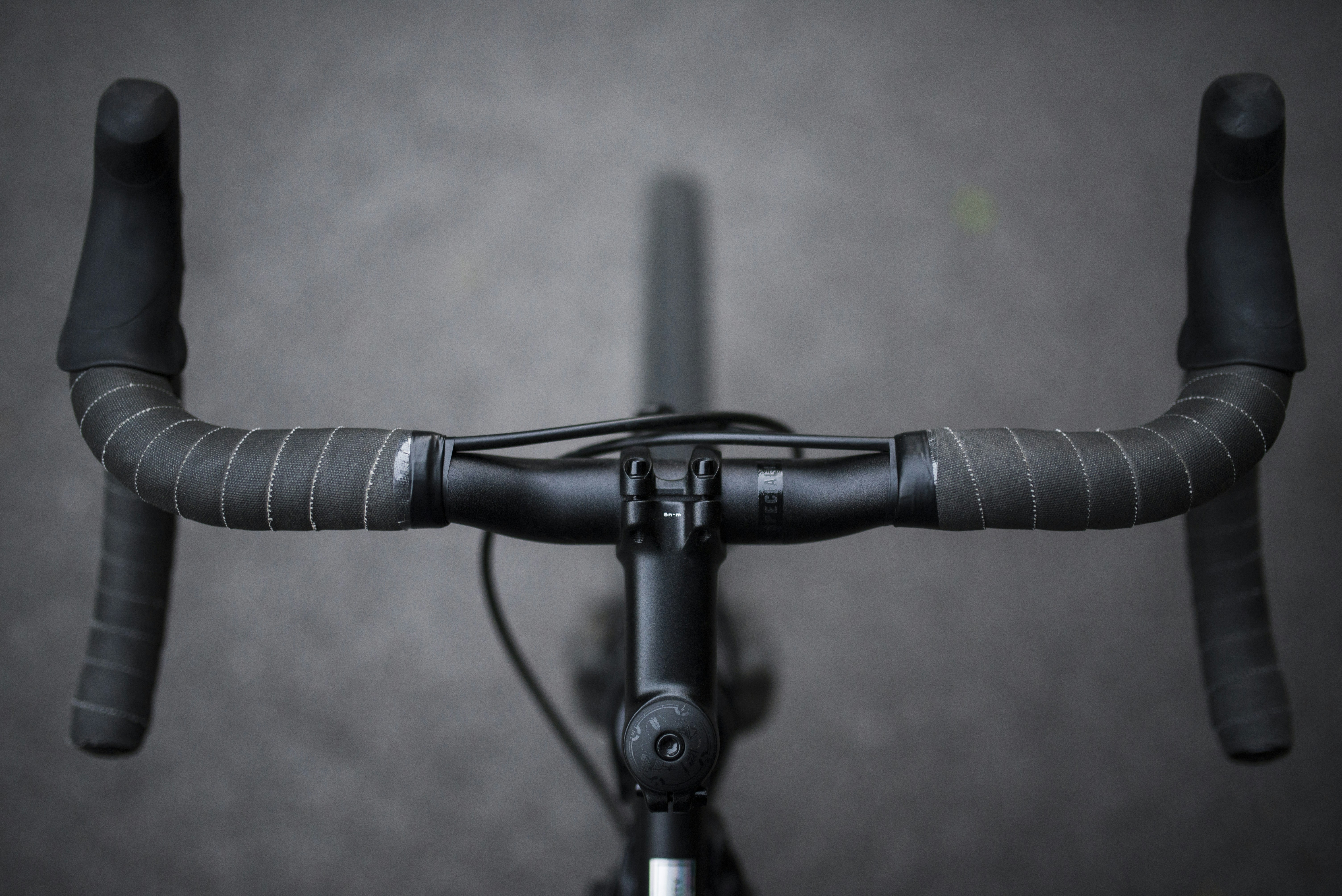 Close-up of a runner's face showing intense exhaustion and sweat, illustrating the pain cave.