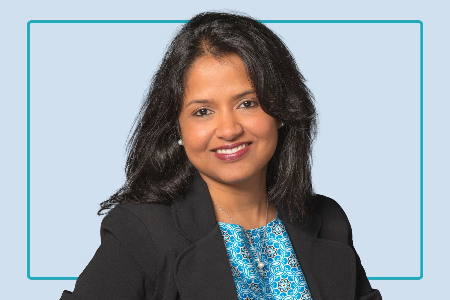 A professional portrait of a woman representing a healthy patient or healthcare provider.