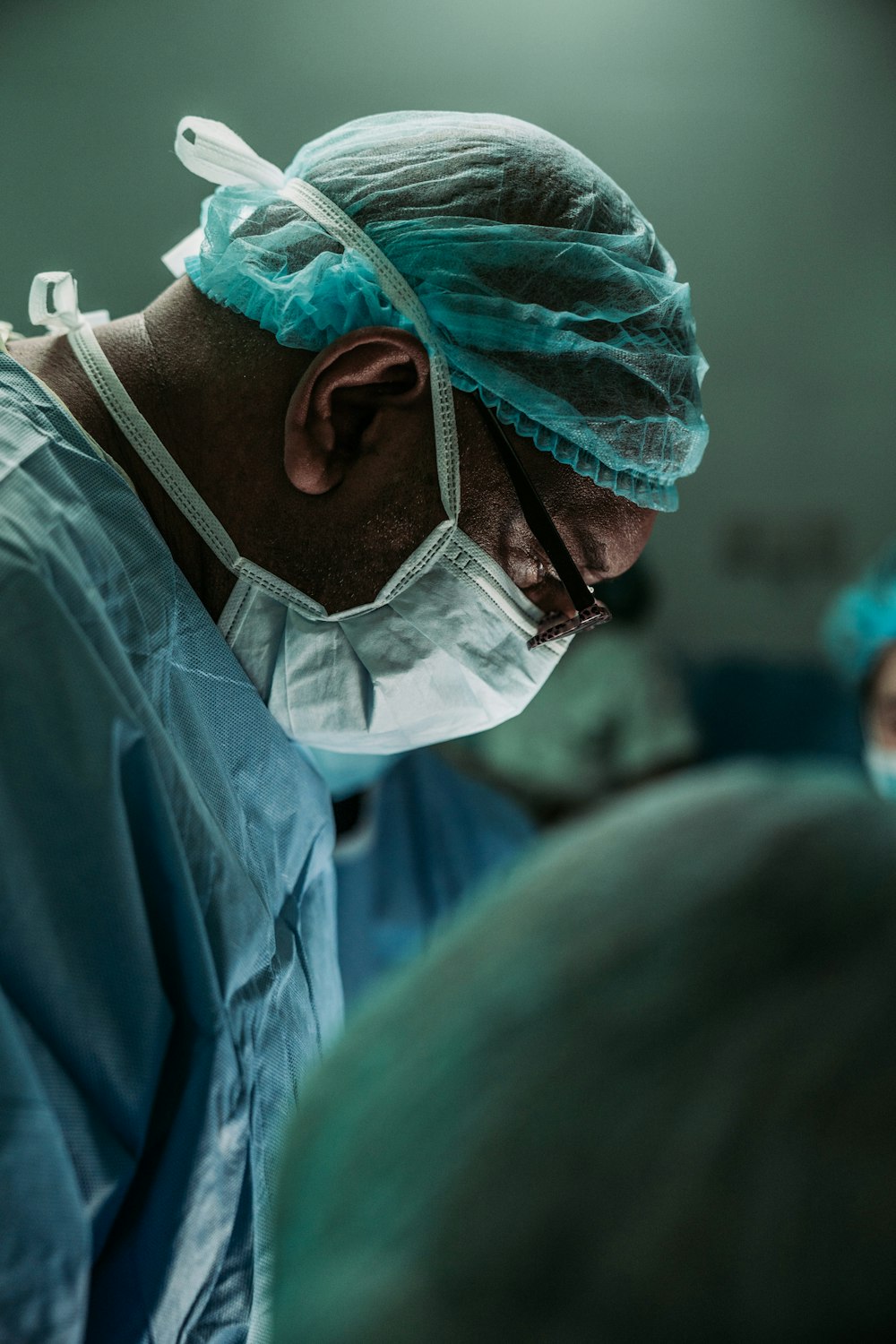 A patient discussing joint stiffness symptoms with a healthcare professional in a medical office.