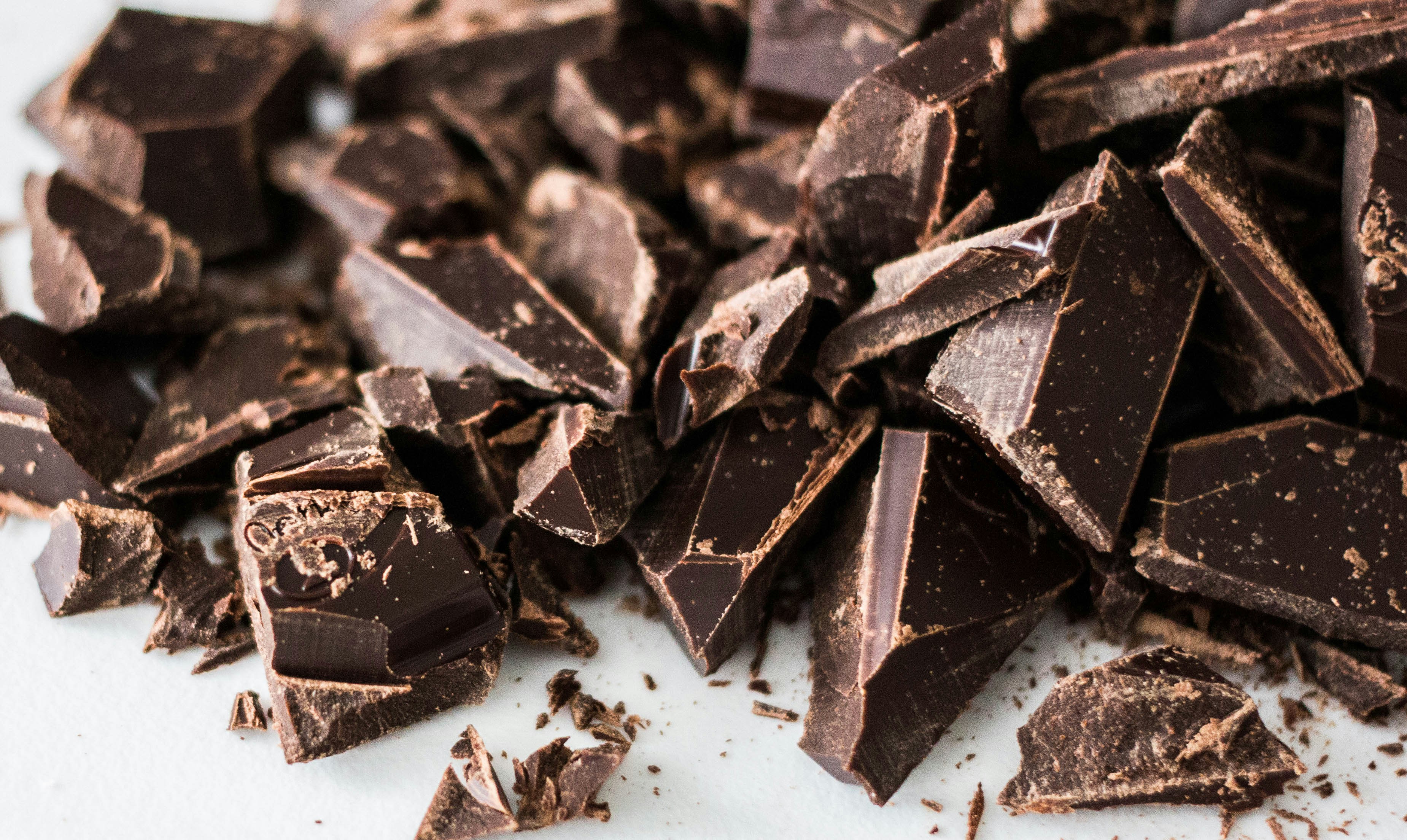 Dark chocolate bars with high cocoa solids broken into pieces.