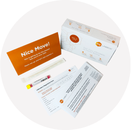 Overhead view of myLAB Box collection kit materials including sample cards and return envelope.