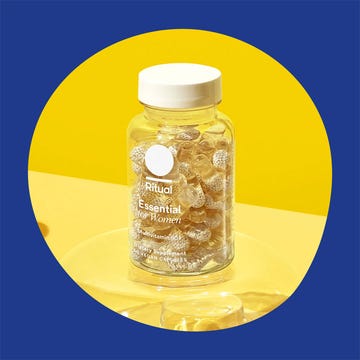Assorted bottles of multivitamins specifically labeled for women of different age groups.