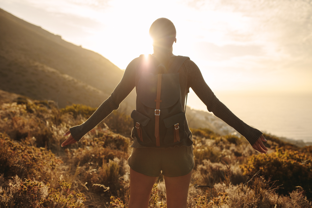 Close-up of a person wearing a tactical-style rucksack.