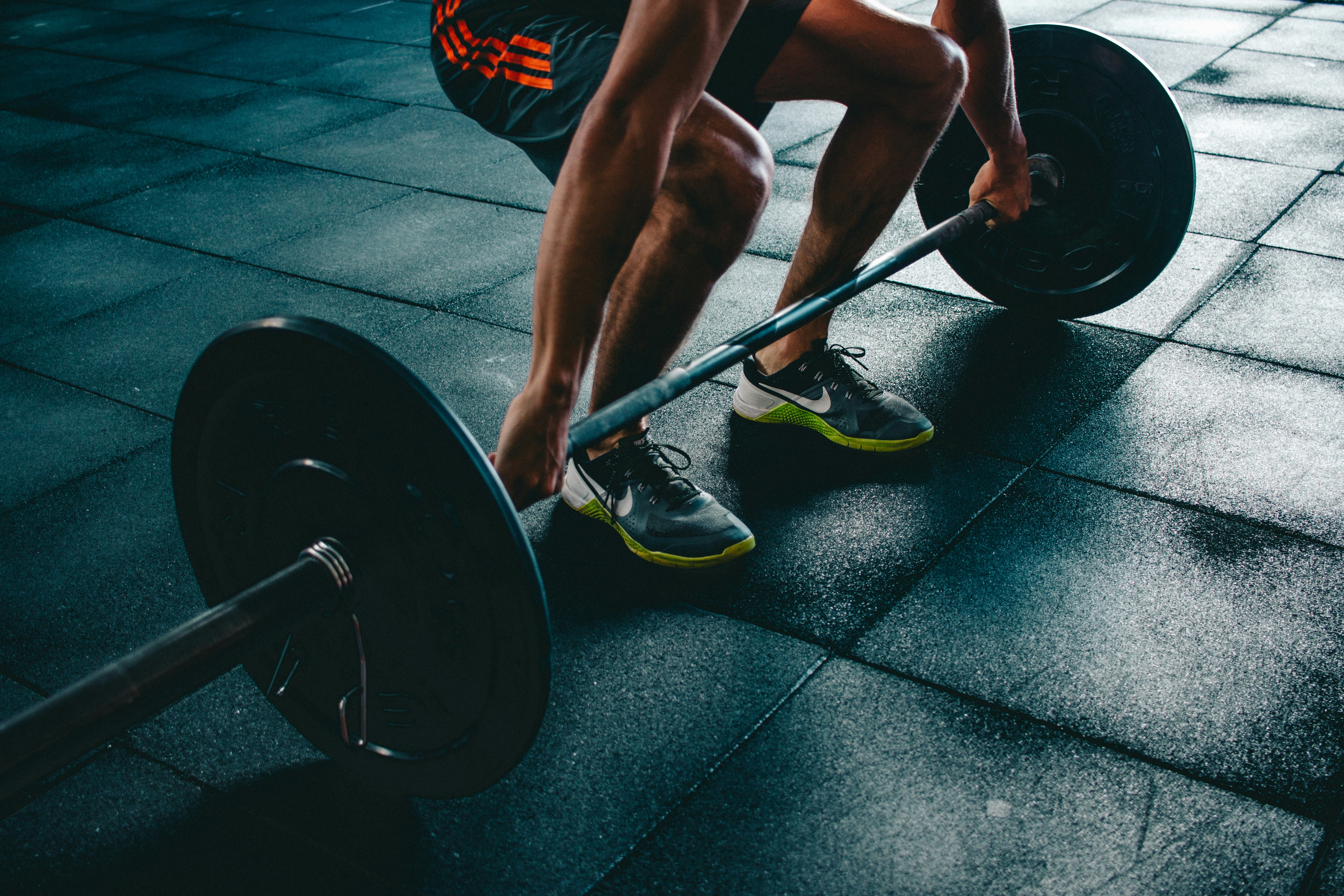 A person performing high-intensity cardio exercises in a gym setting.