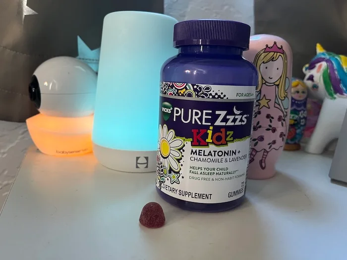 A bottle of Vicks Pure ZZZs Kids Melatonin Gummies.