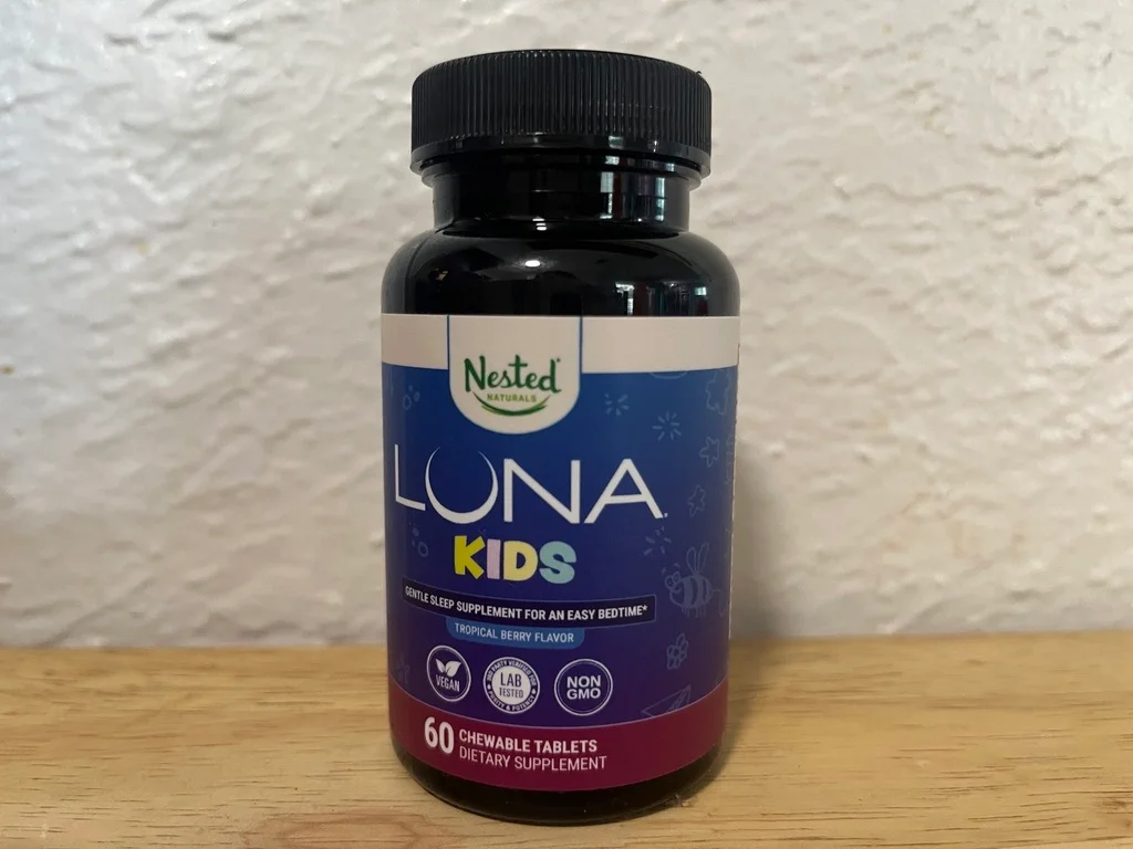 A bottle of Nested Naturals Luna Kids Gentle Sleep Aid.
