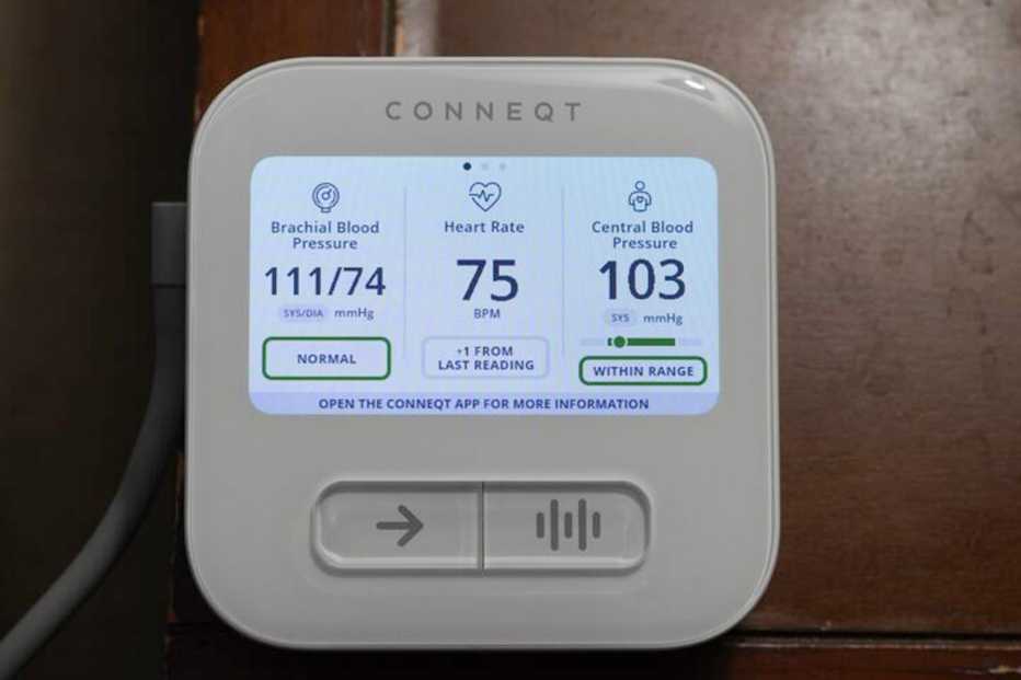 A digital blood pressure monitor screen showing readings of 118 over 78 mmHg and a pulse of 70 bpm.