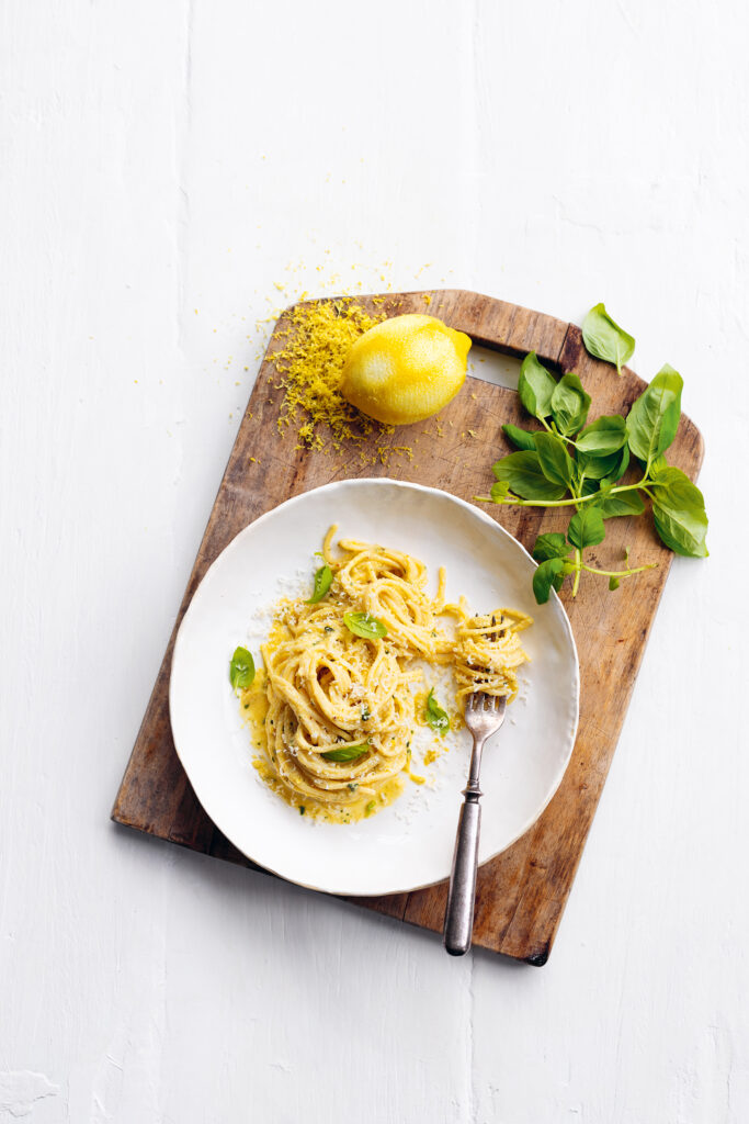 Donna Hay's signature lemon pesto spaghetti served in a minimalist style.