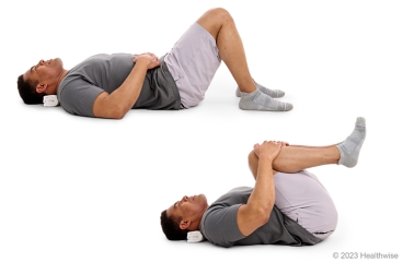 Person performing a double knee-to-chest stretch on a mat