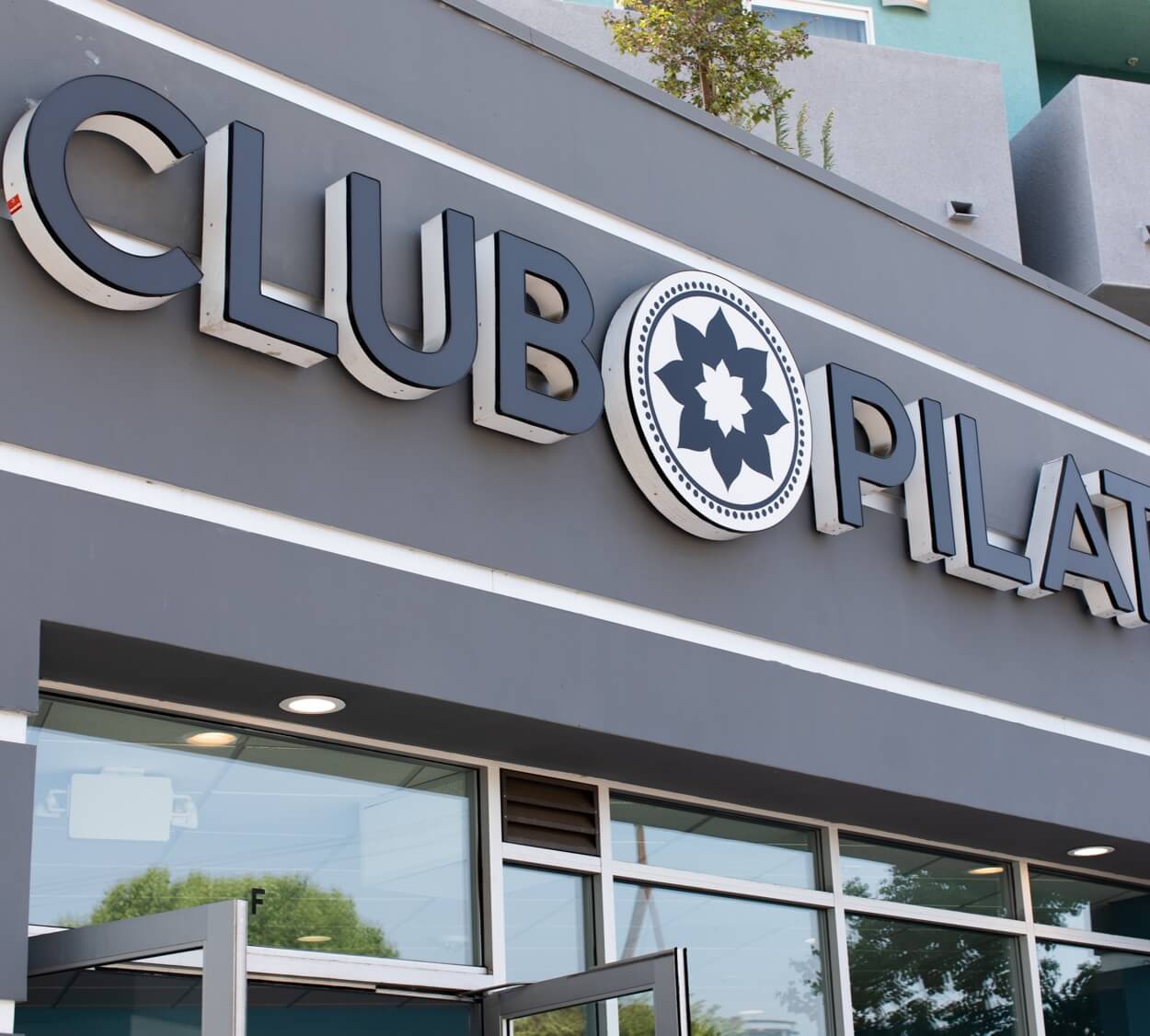 Club Pilates branding and signage on a studio exterior.