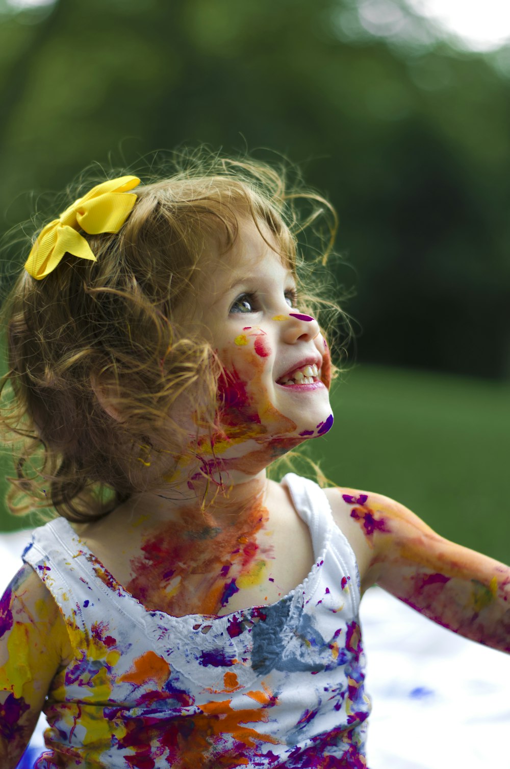 A happy child running and playing outdoors, representing a full and active life.