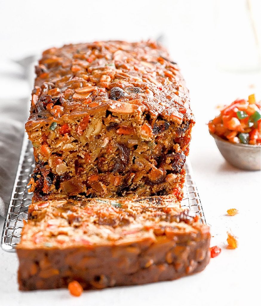 Close-up of the crumb structure and fruit distribution in a vegan Christmas cake.